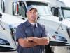Inspector Standing in Front of Truck
